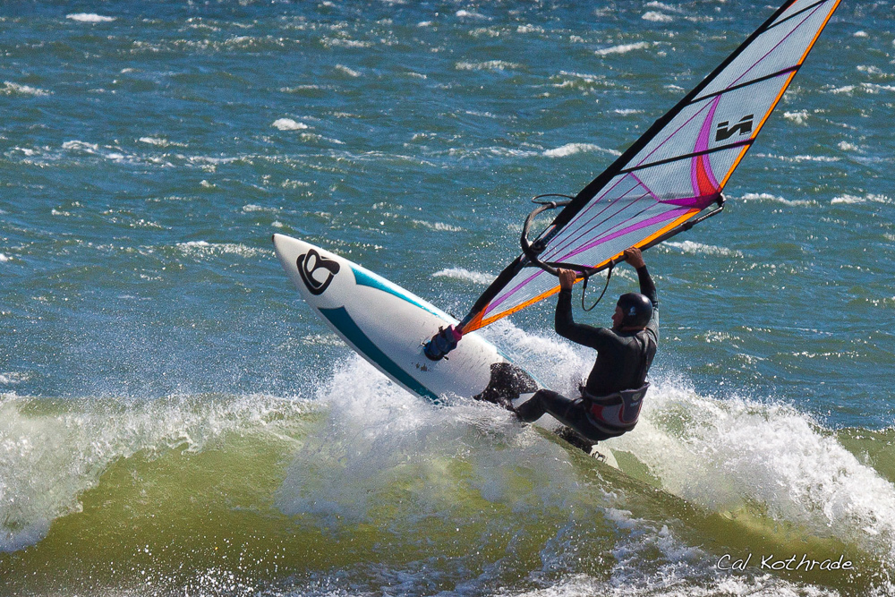 Windsurfer and wave in California.