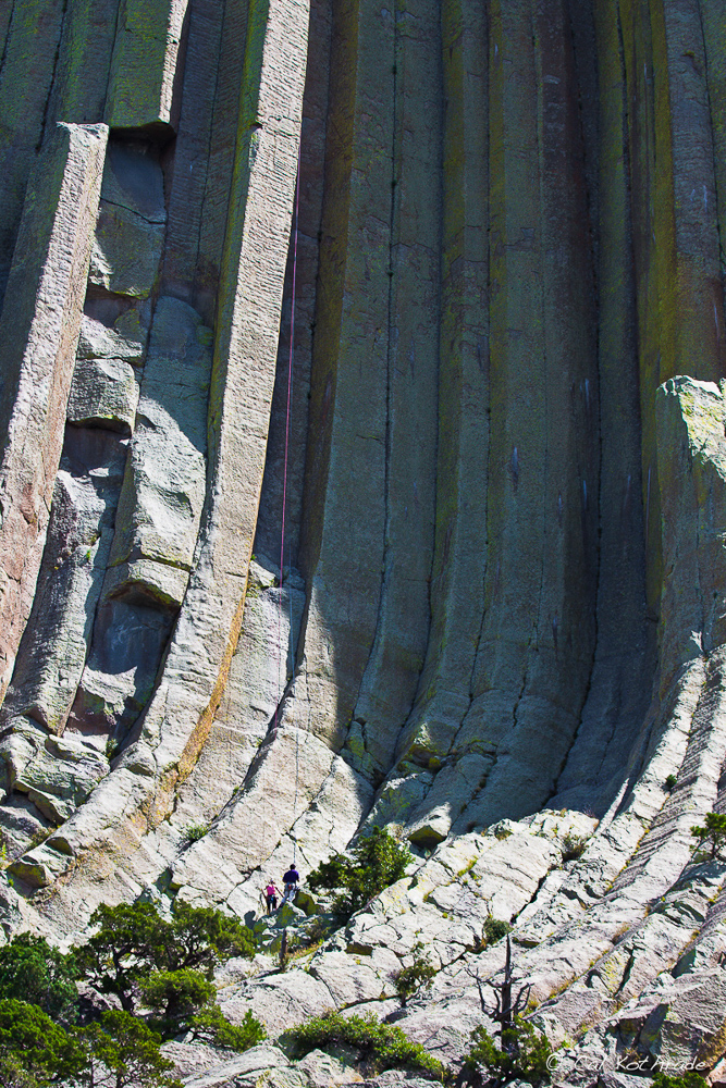 Climbers scaling Devil's Tower, Wyoming
